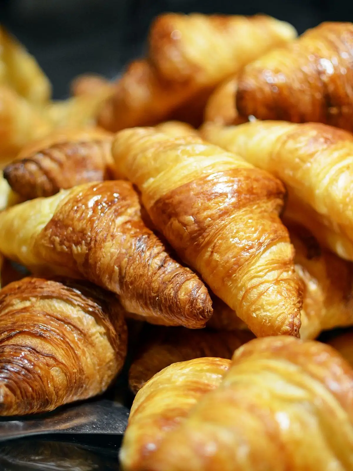 A tray of freshly baked butter croissants